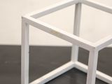 a picture of a small white box on a table