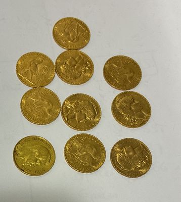a lot of gold coins sitting on a white surface
