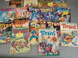 a lot of comic books that are on the table