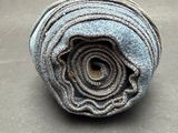a rolled up roll of fabric on a table