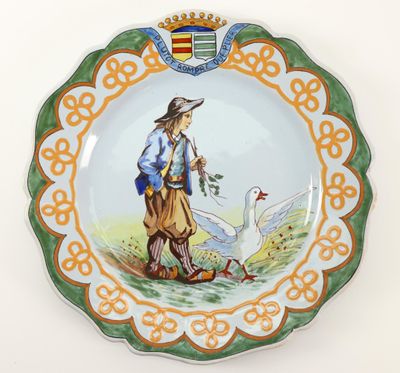 a plate with a picture of a man and a goose on it