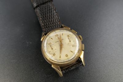 a close up of a wrist watch on a table