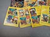 a lot of comic books on the table