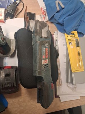 a picture of a cluttered workbench with tools on it