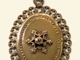 an image of a gold locke with a horse on it