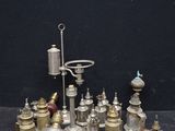 a lot of silver and brass items sitting on a table