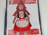 a little girl dressed in a little red riding hood