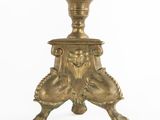 an antique brass candle holder on a white background with a white background