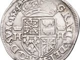 a close up of a silver coin with a coat of arms on it