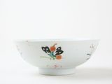 a white bowl with a butterfly design on it