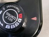 a close up of a black camera on a table