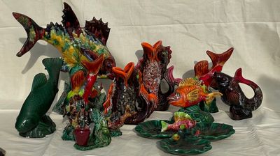 many figurines of different shapes and sizes on a white surface