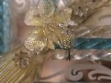 a close up of a woman ' s head wearing a tiaper