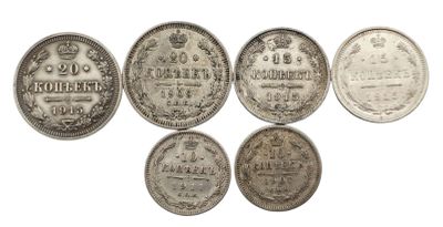 six types différents de pièces d'argent sont représentés sur un fond blanc