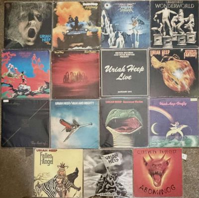 many different album covers on the floor of this room