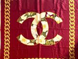 red and gold chanel scarf with white flowers and gold chains