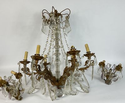a chandelier that is made of glass and has five lights