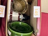many plates and bowls in a box on the table