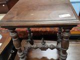 a small table with a wooden top on a table in a room