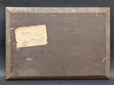 an old suitcase with a label on it