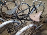 many bicycles that are parked together in a garage