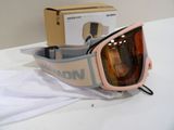 a pair of goggles sitting on a table next to a box