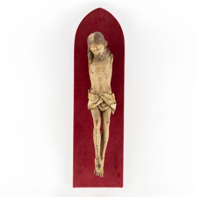 a wooden crucifix with a red velvet case