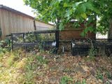 a fence that has a bench in the middle of it