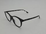 a pair of glasses sitting on top of a white surface