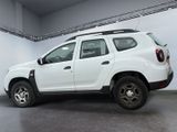 the rear end of a white dacia parked in a garage