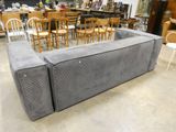 a couch that is sitting in the middle of a room