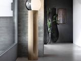 a lamp that is sitting on the floor in a room