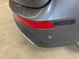 a close up of a car ' s rear end with a sticker on it