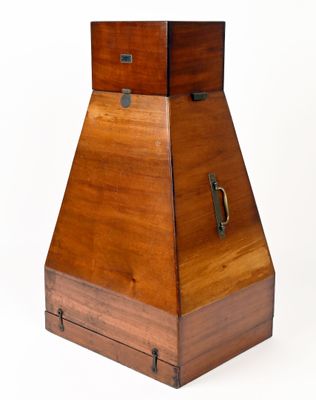 an image of a wooden box with a metal handle on a white background
