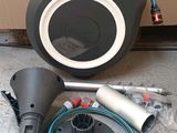 an image of a black speaker with a cord and a blower