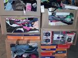 boxes of clothing are stacked on top of each other in a warehouse