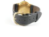 an image of a wrist watch with a black strap and a gold buckle