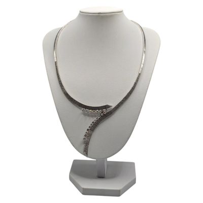 necklace with a snake on a mannequin stand on a white background