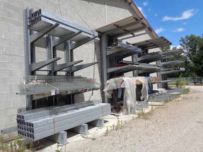 a building that has a bunch of shelves on the side of it