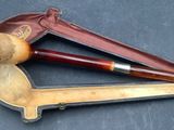 a pipe and a pipe holder on a table