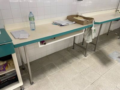a long table with a bottle of water on top of it