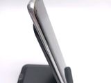 a close up view of a cell phone on a stand