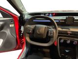 a car dashboard with a steering wheel and a dash board