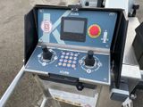a machine that is sitting on the side of the road
