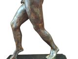 statue of a man holding a tennis racquet on a marble base