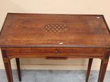 a small wooden table with a drawer on top of it