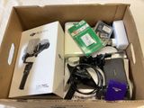 a cardboard box with a bunch of electronics inside of it