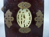 a wooden box with a carved picture of a woman on it