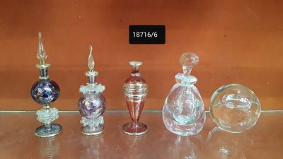 a lot of glass bottles that are sitting on a table