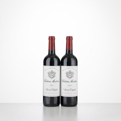 two bottles of wine sitting on top of a table next to each other